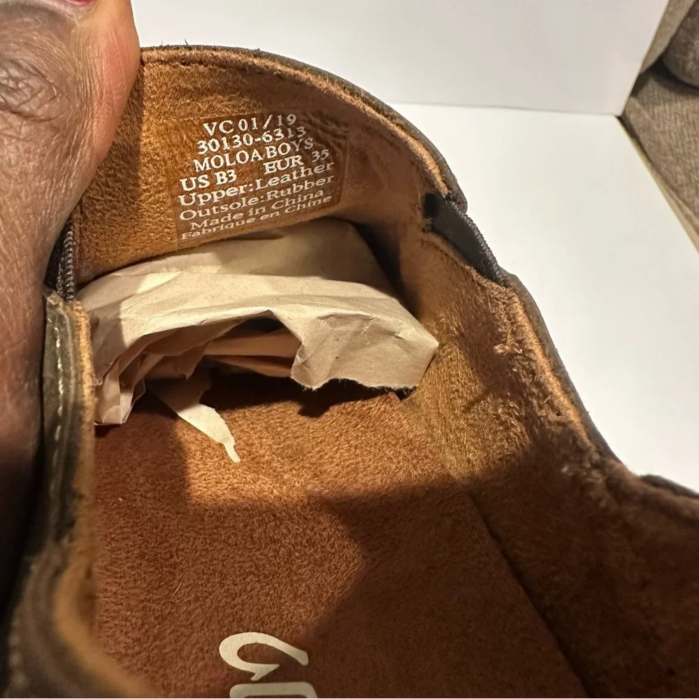 Olukai Moloa Boy's Leather Slip on shoe in a dark wood Color